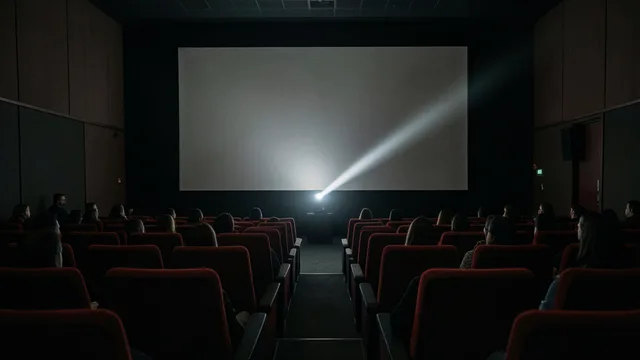 Imagem gerada por IA: Sala de cinema com fileiras de poltronas vermelhas diante de uma tela iluminada.