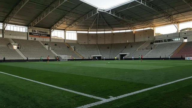 Imagem gerada por IA: Jogadores treinam ao longe no gramado do Estádio Centenário, em Caxias do Sul.