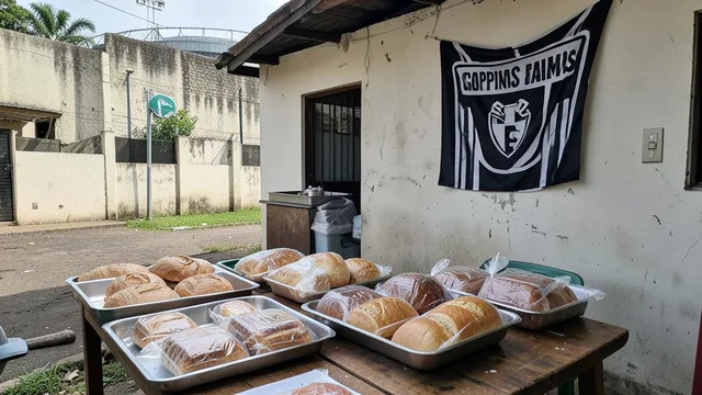 Imagem gerada por IA: Alimentos preparados em uma padaria de Campinas, com uma faixa alvinegra ao fundo.