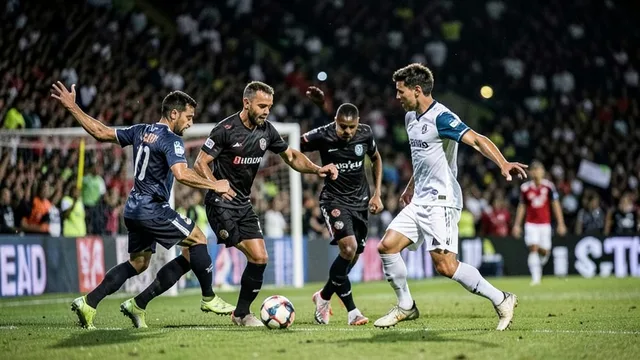 Imagem gerada por IA: Jogadores disputam a bola perto da área em um estádio lotado durante uma partida noturna.